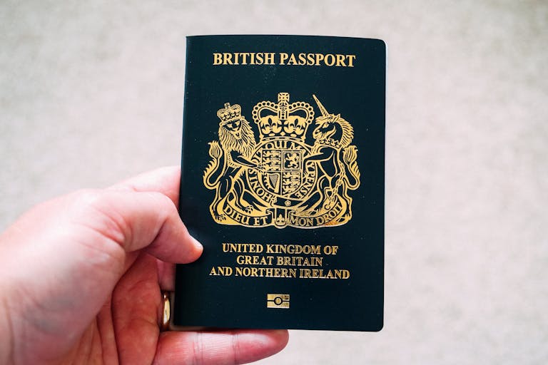 Crop unrecognizable person demonstrating British passport