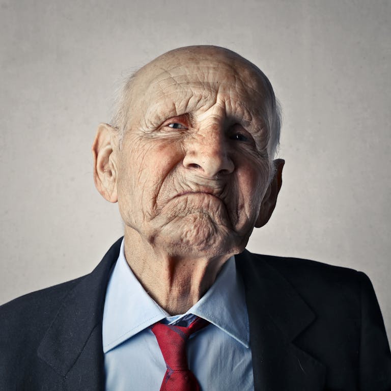 Portrait Photo of Man in Black Formal Coat