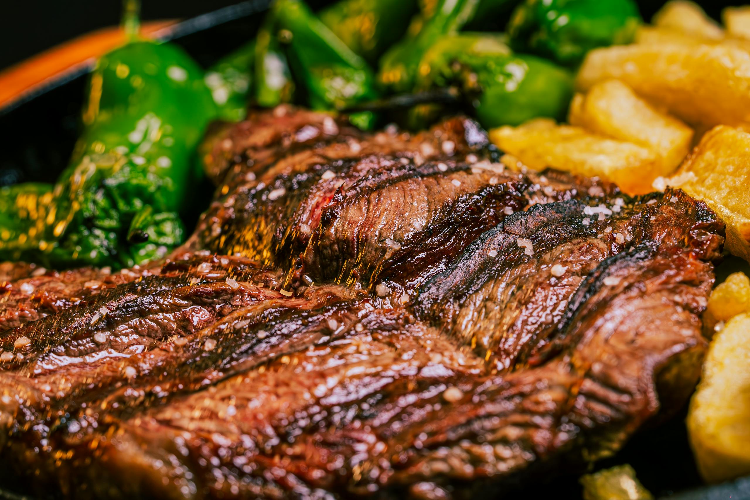 A steak and potatoes are on a plate