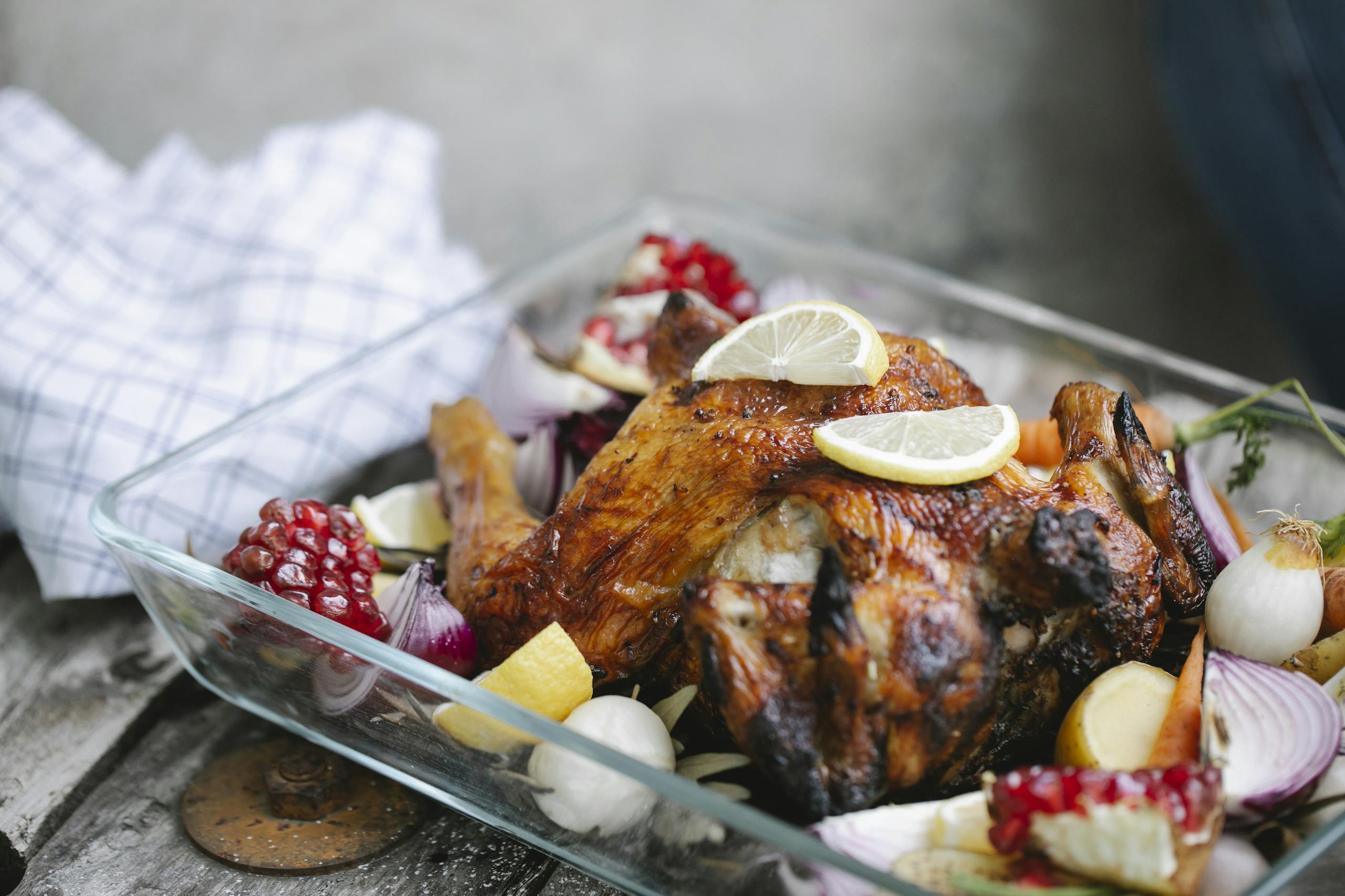 Delicious roasted chicken with vegetables in glass form