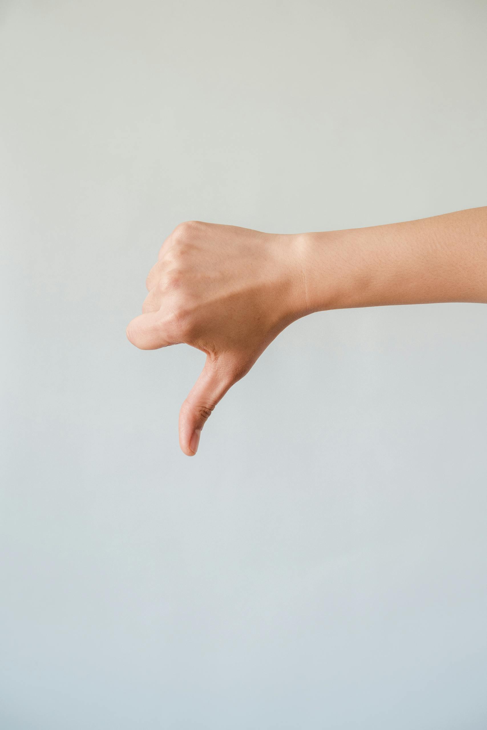 A Person Doing a Thumbs Down