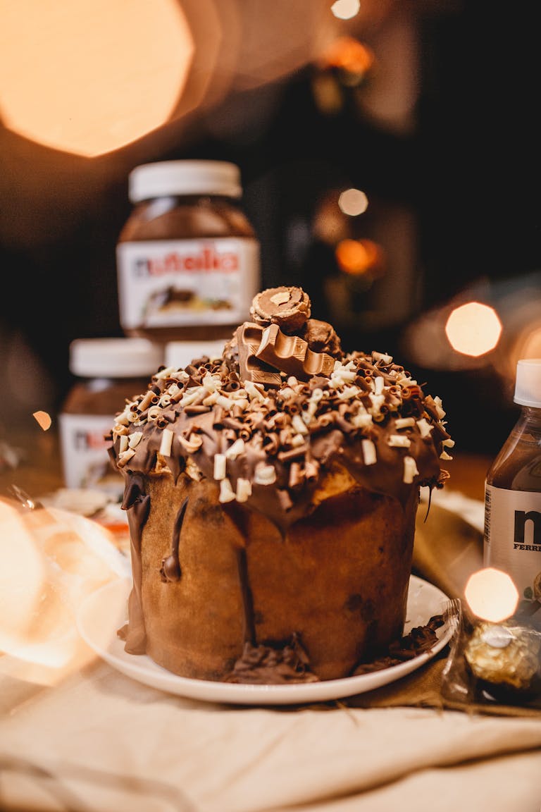 Rich chocolate cake topped with Nutella, creating a tempting dessert experience.